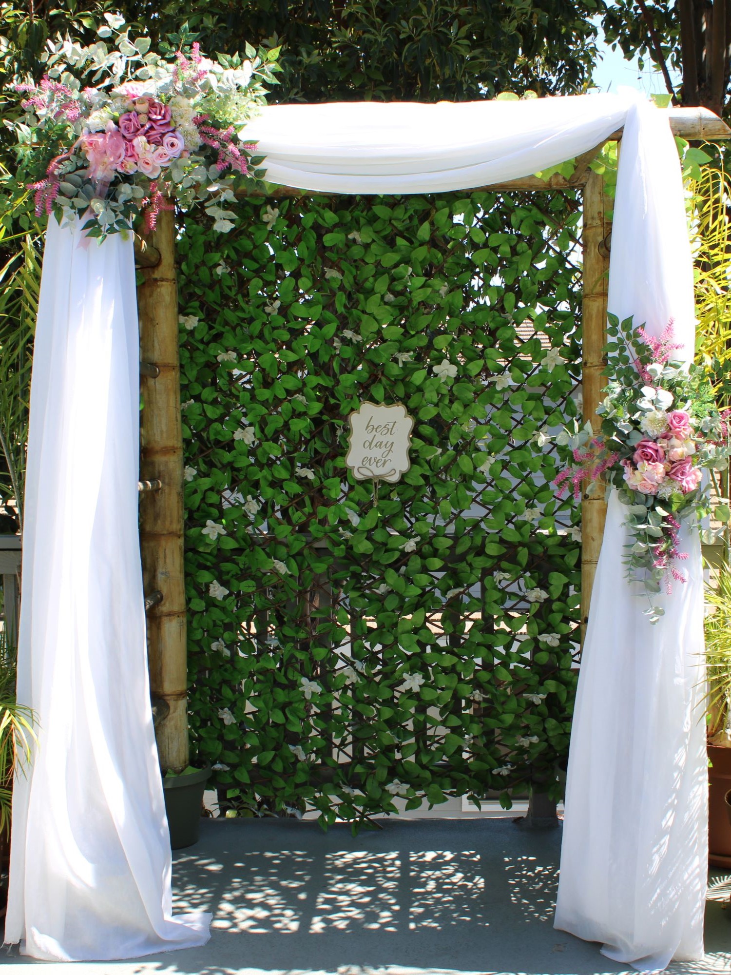 Pink roses wedding arch flowers